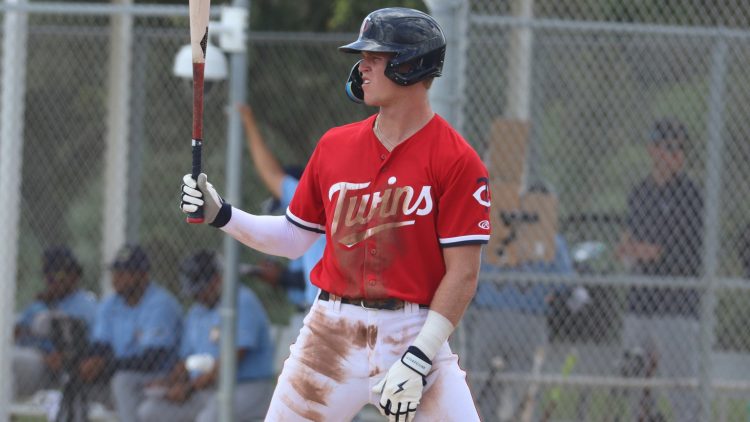 Walker Jenkins at bat, holding the bat in his right hand