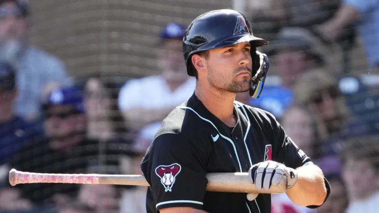 Ryan Waldschmidt holding his bat under his arm.